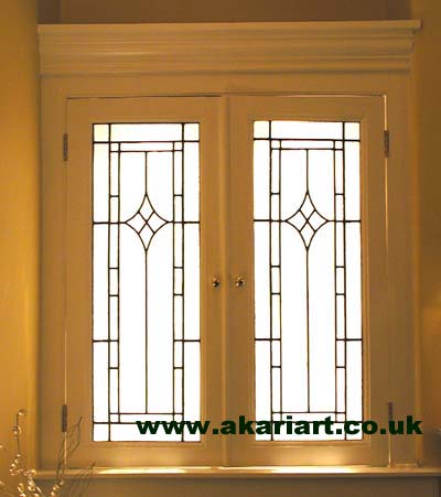 These cupboard door panels are illuminated by the back lighting built into the cupboard for a subtle effect